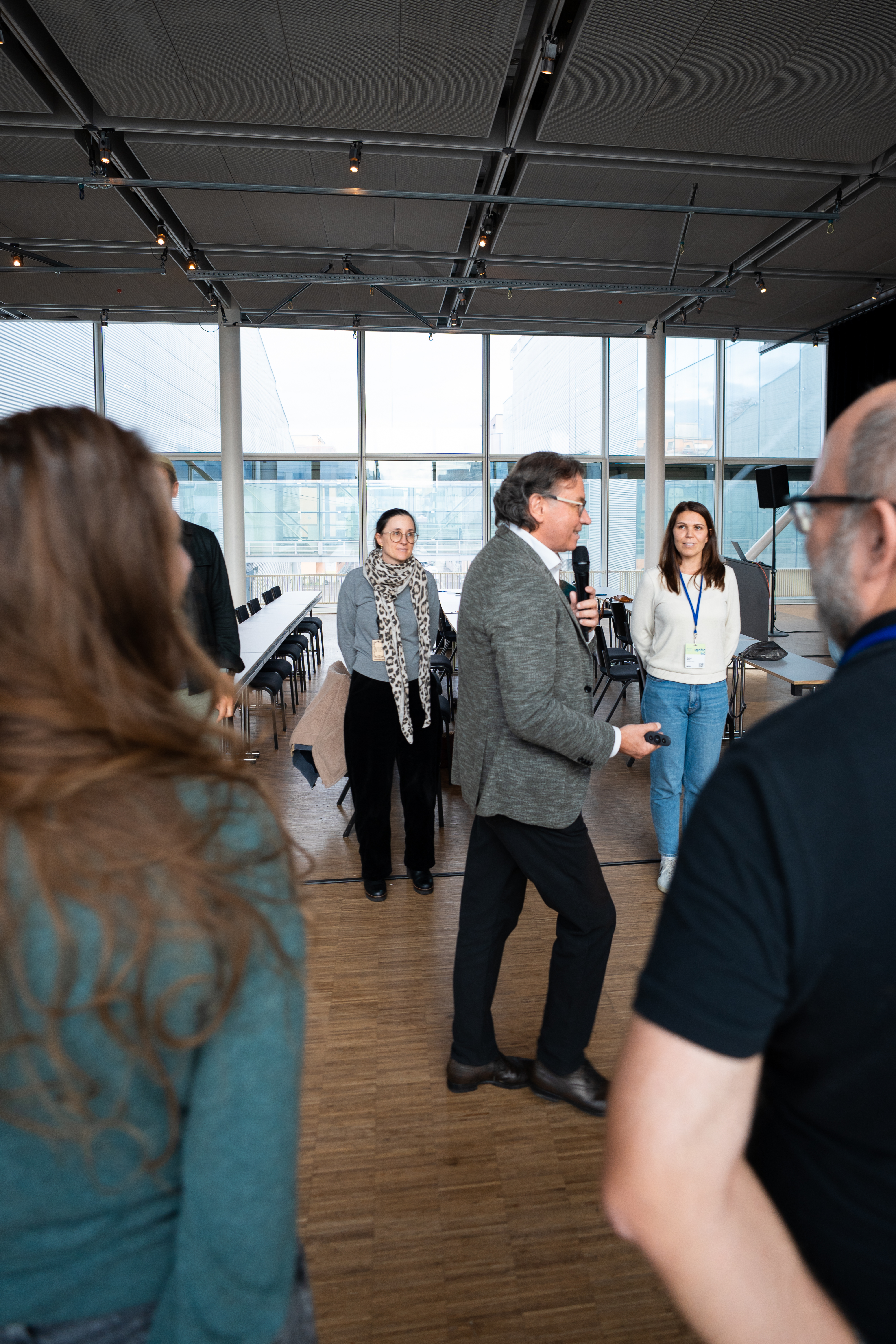Audience reacting during a tech talk.